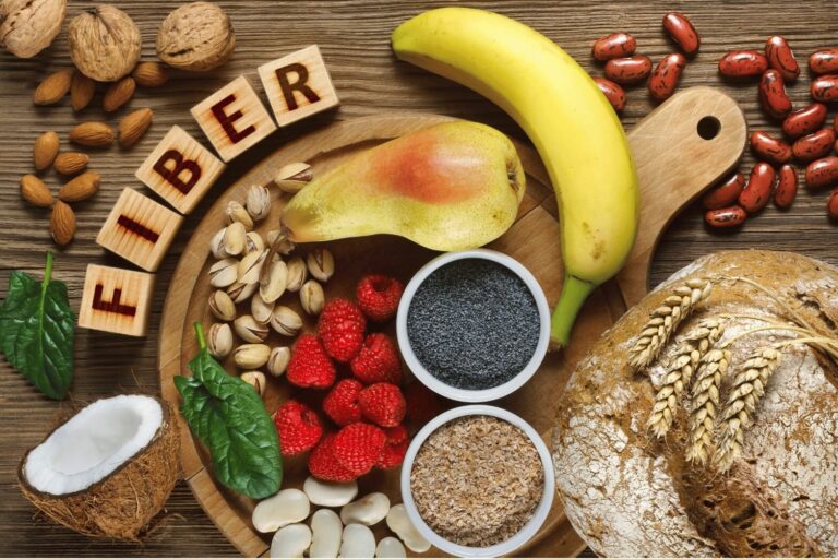 A healthy lifestyle concept showing high-fiber foods and drinks that support gut health and fibermaxxing for optimal intake